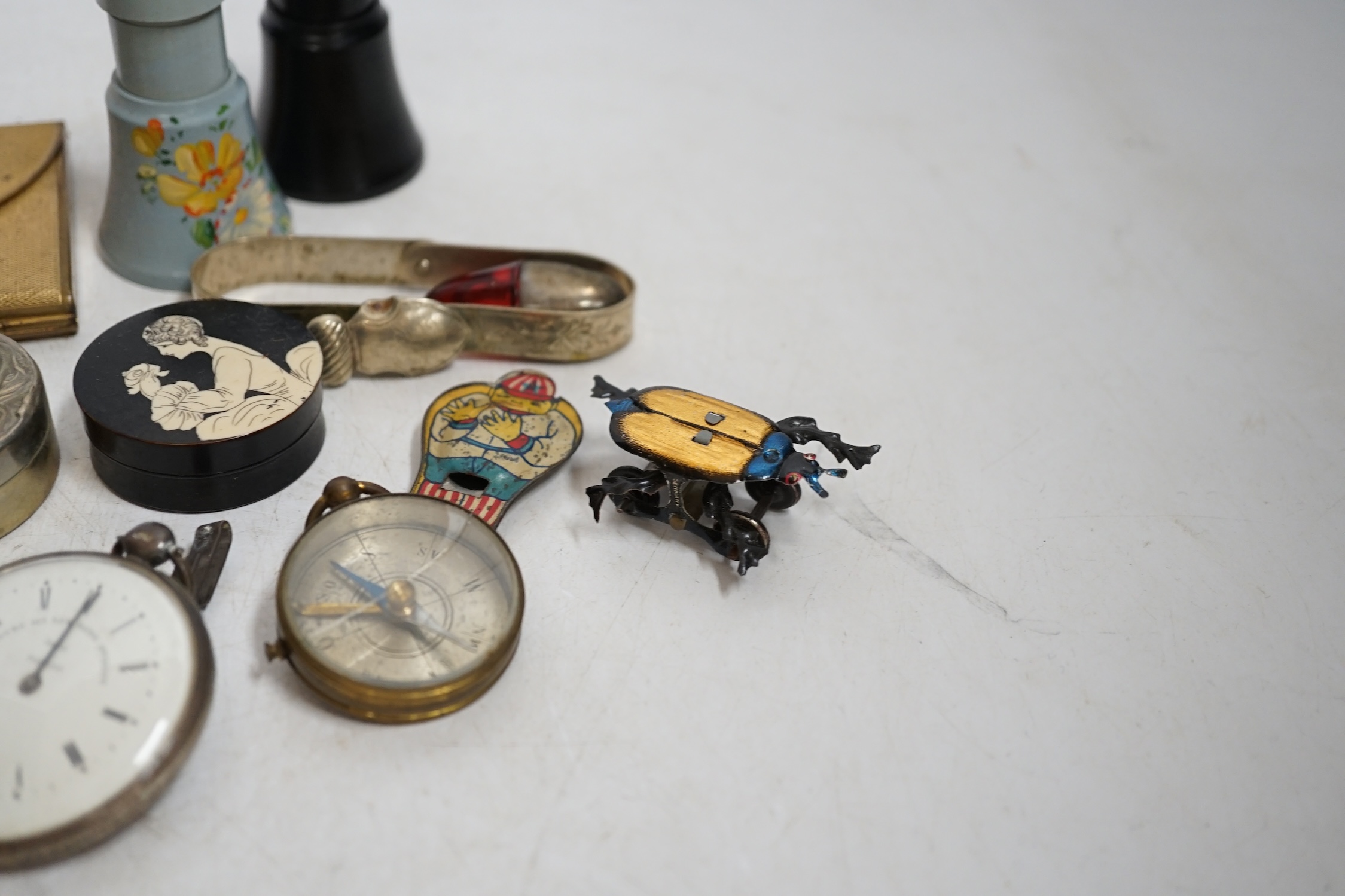 A group of mixed collectables and objects to include Bakelite boxes, pen knives, white metal charms and a gilt metal compact, etc. Condition - varies, fair